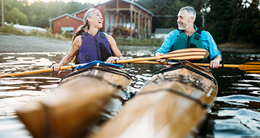 Mature couple in kayaking on a lake