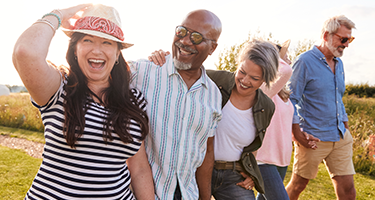 a group of 5 mature people going for a walk